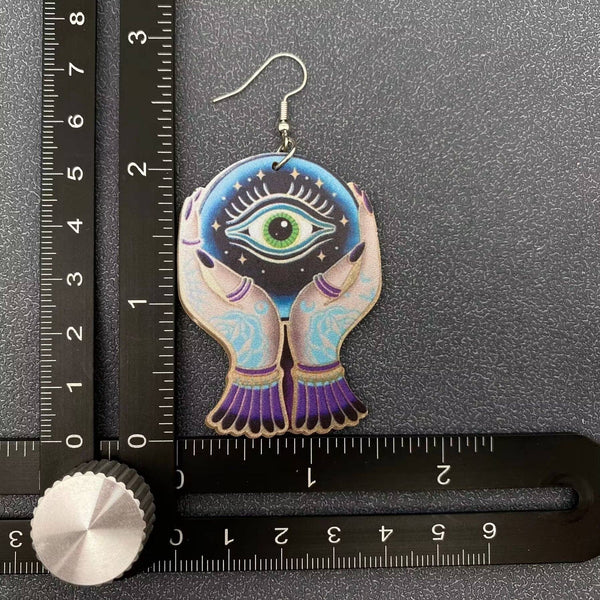 Holding Devil's Eye Crystal Ball Acrylic Dangle Earrings