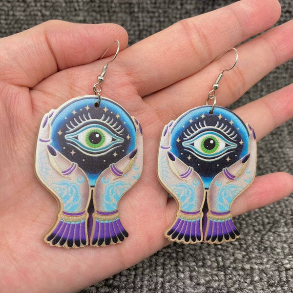 Holding Devil's Eye Crystal Ball Acrylic Dangle Earrings